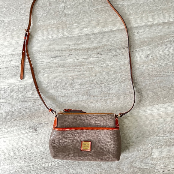 Dooney & Bourke Handbags - Small leather crossbody bag.
